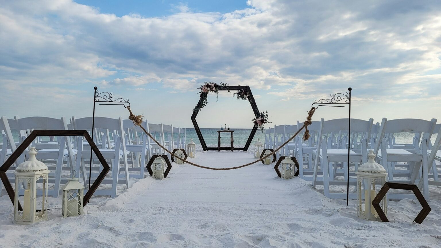 A quickie wedding chapel is set up for a sunset wedding on the beach and I be there.