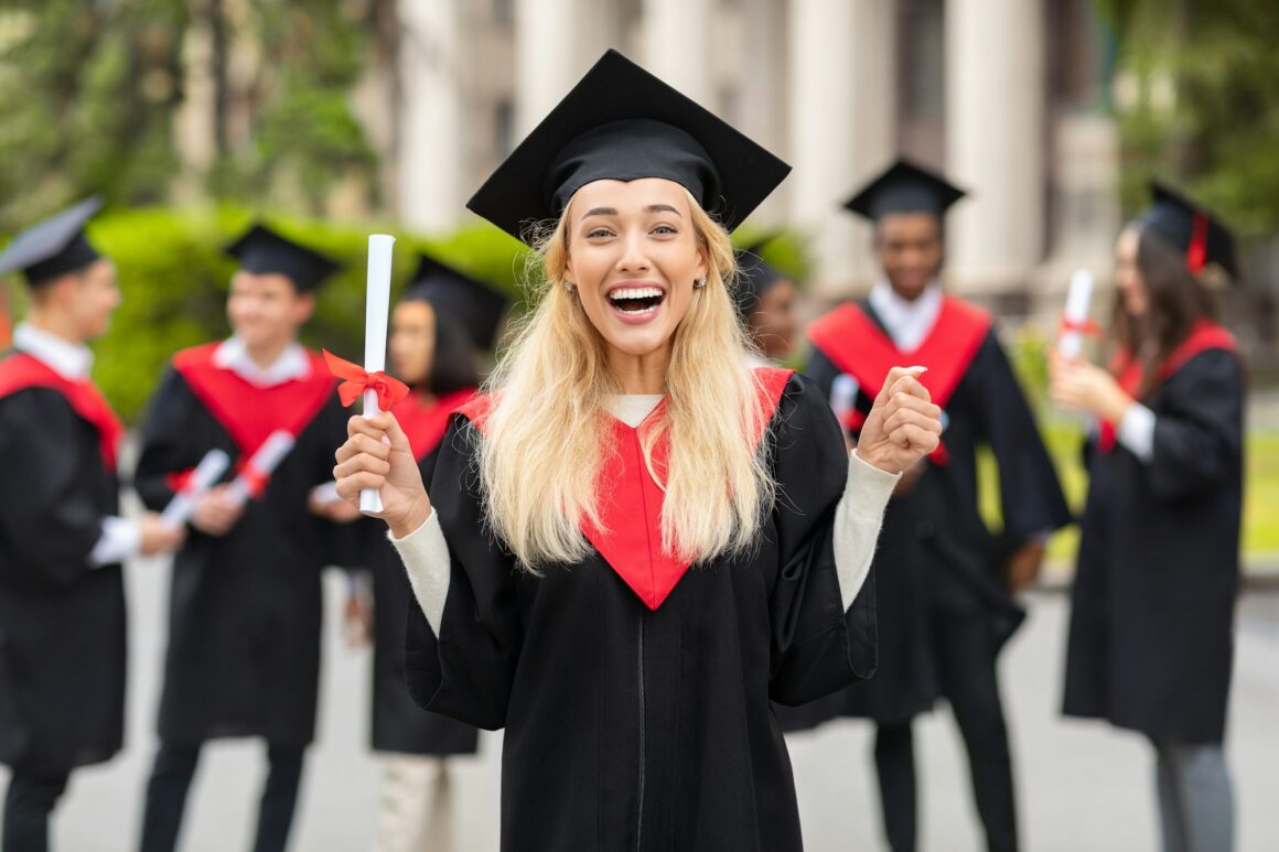 Emotional blonde lady student having graduation party