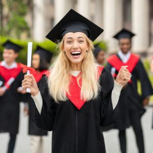 Emotional blonde lady student having graduation party